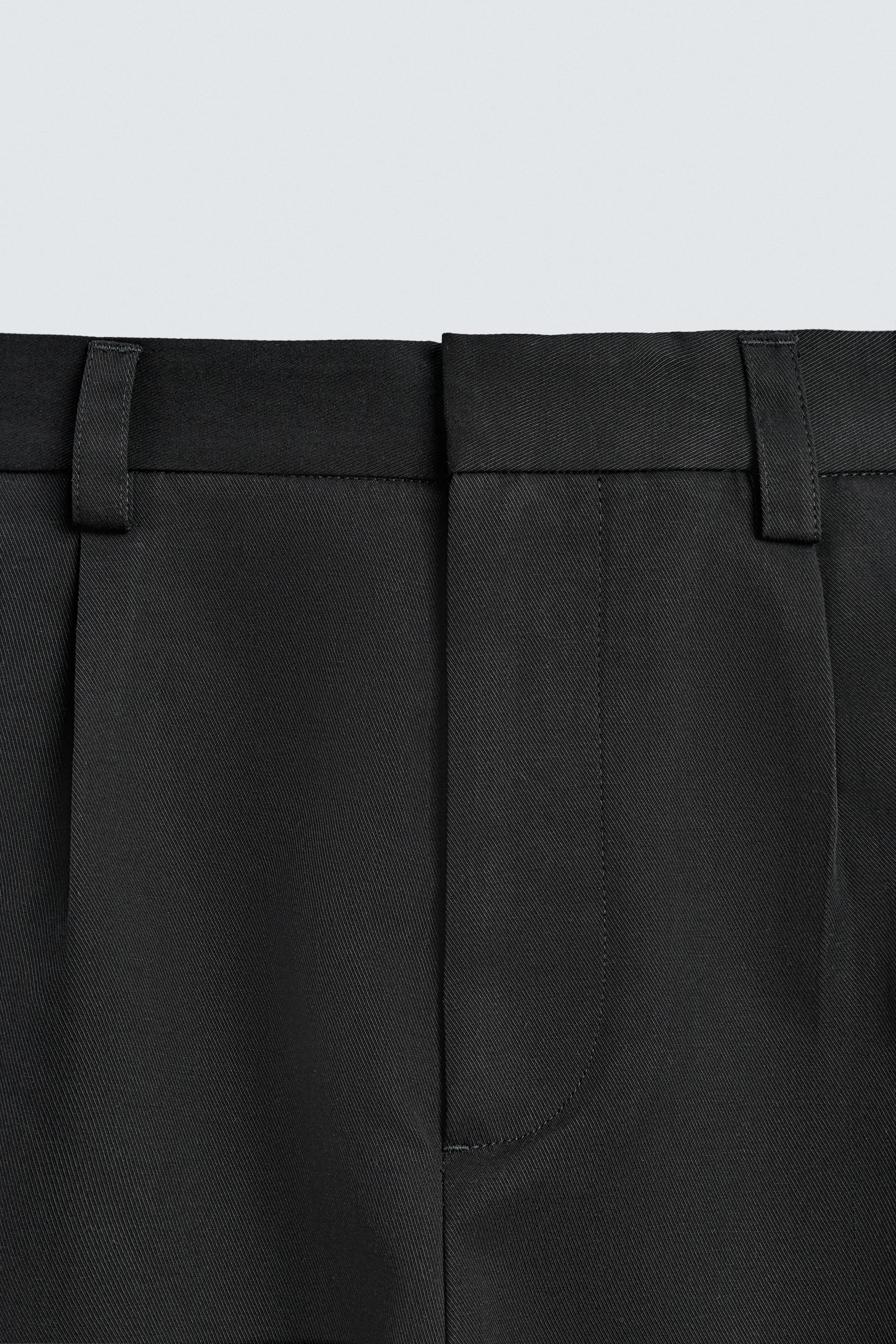 PANTALON COUPE LARGE À PLIS